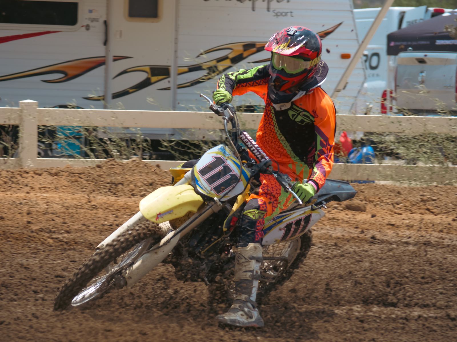 Rider leaning hard into a dirt corner
