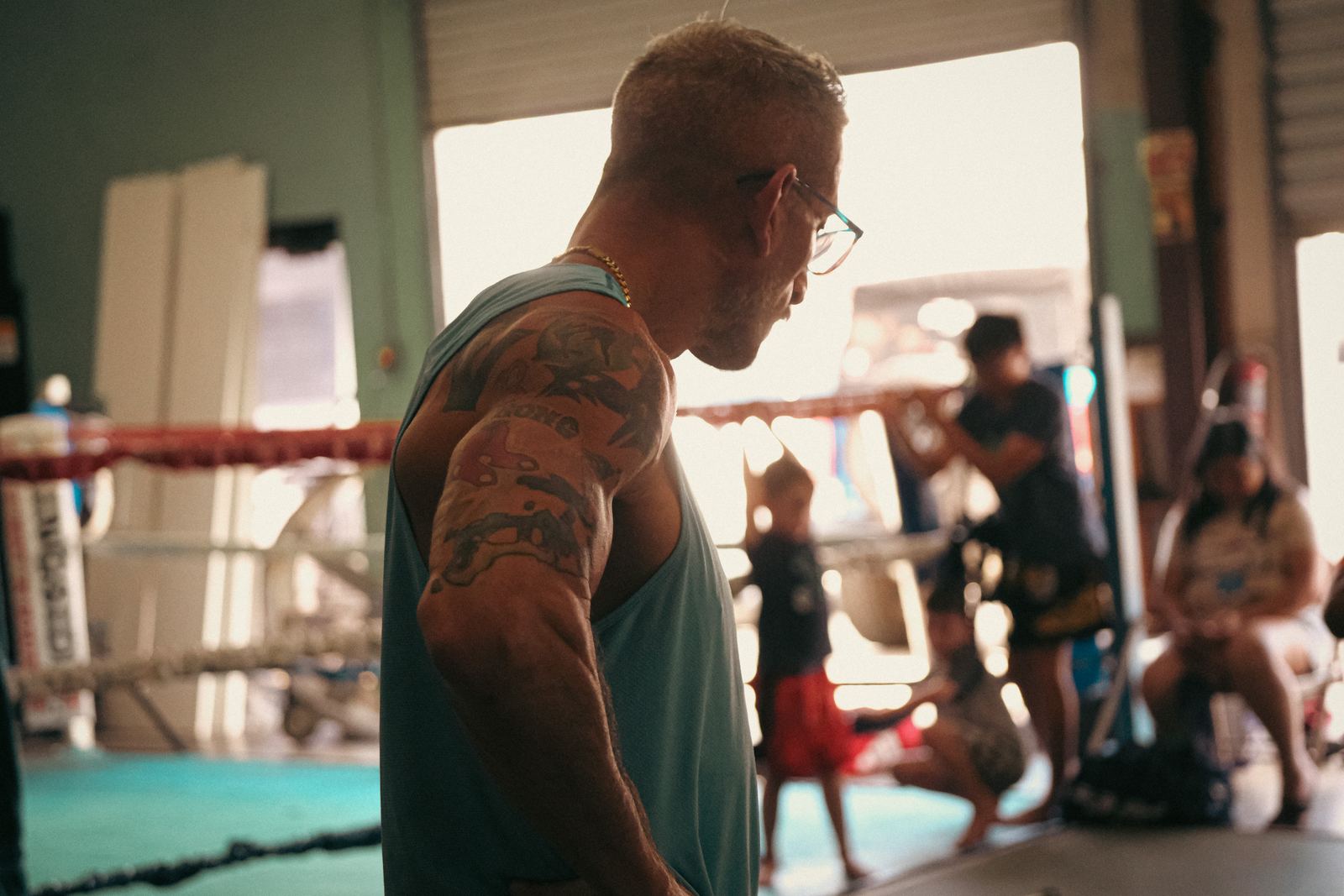 Muay Thai coach watching his fighters train