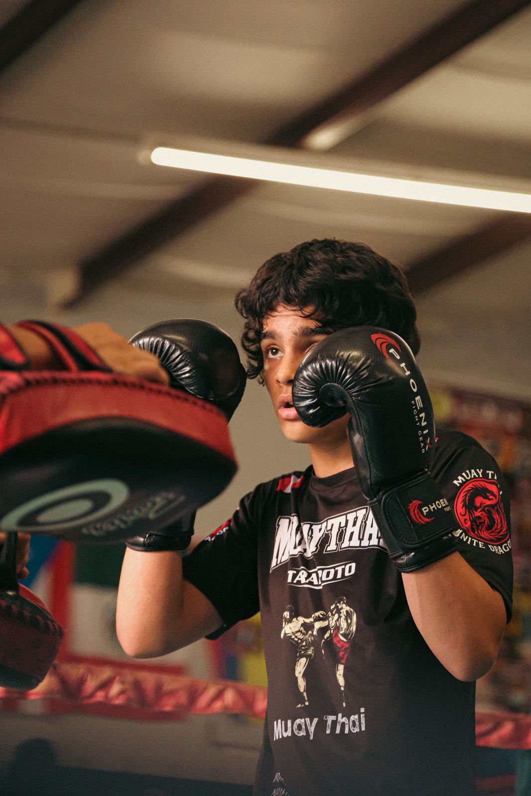 Muay Thai fighter holding his guard in the gym