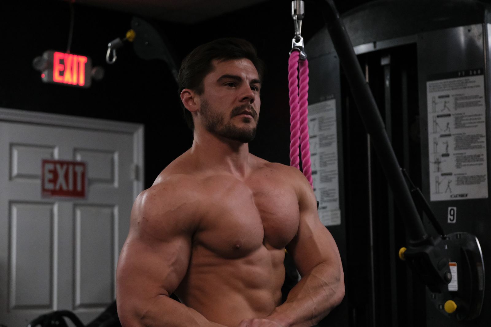 Bodybuilder flexing in the gym