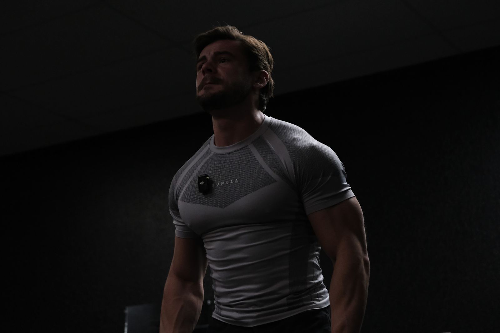 Athlete silhouette in a dark gym