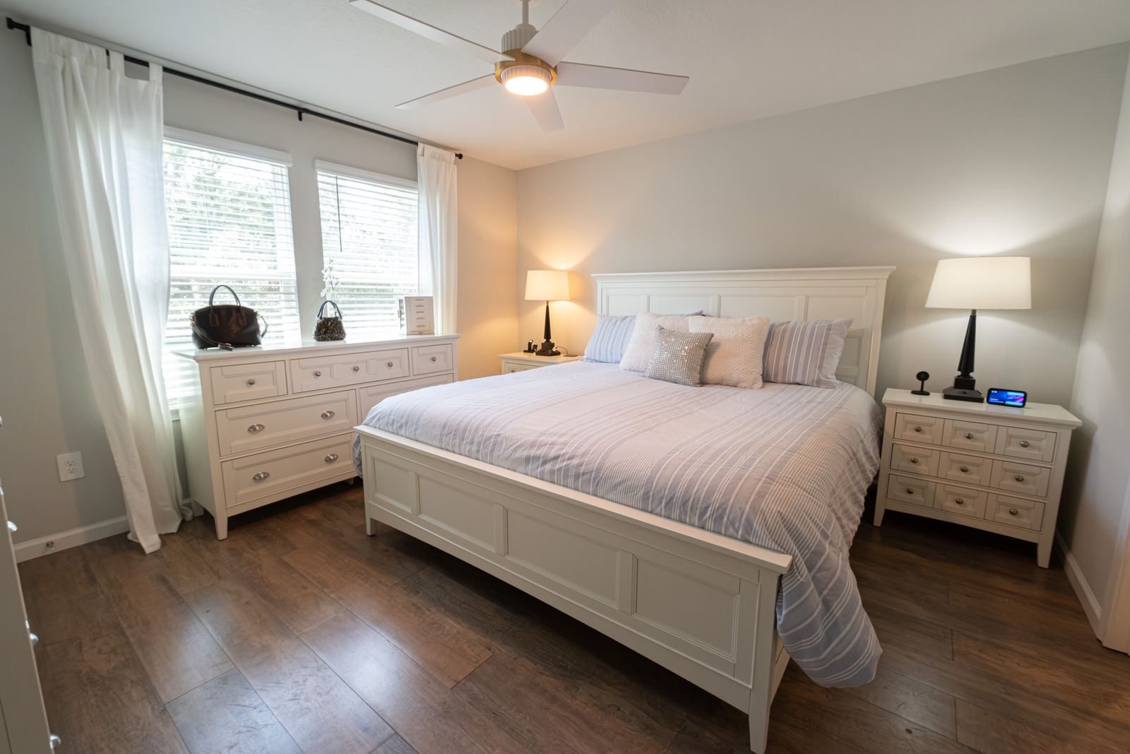 Primary bedroom with large windows