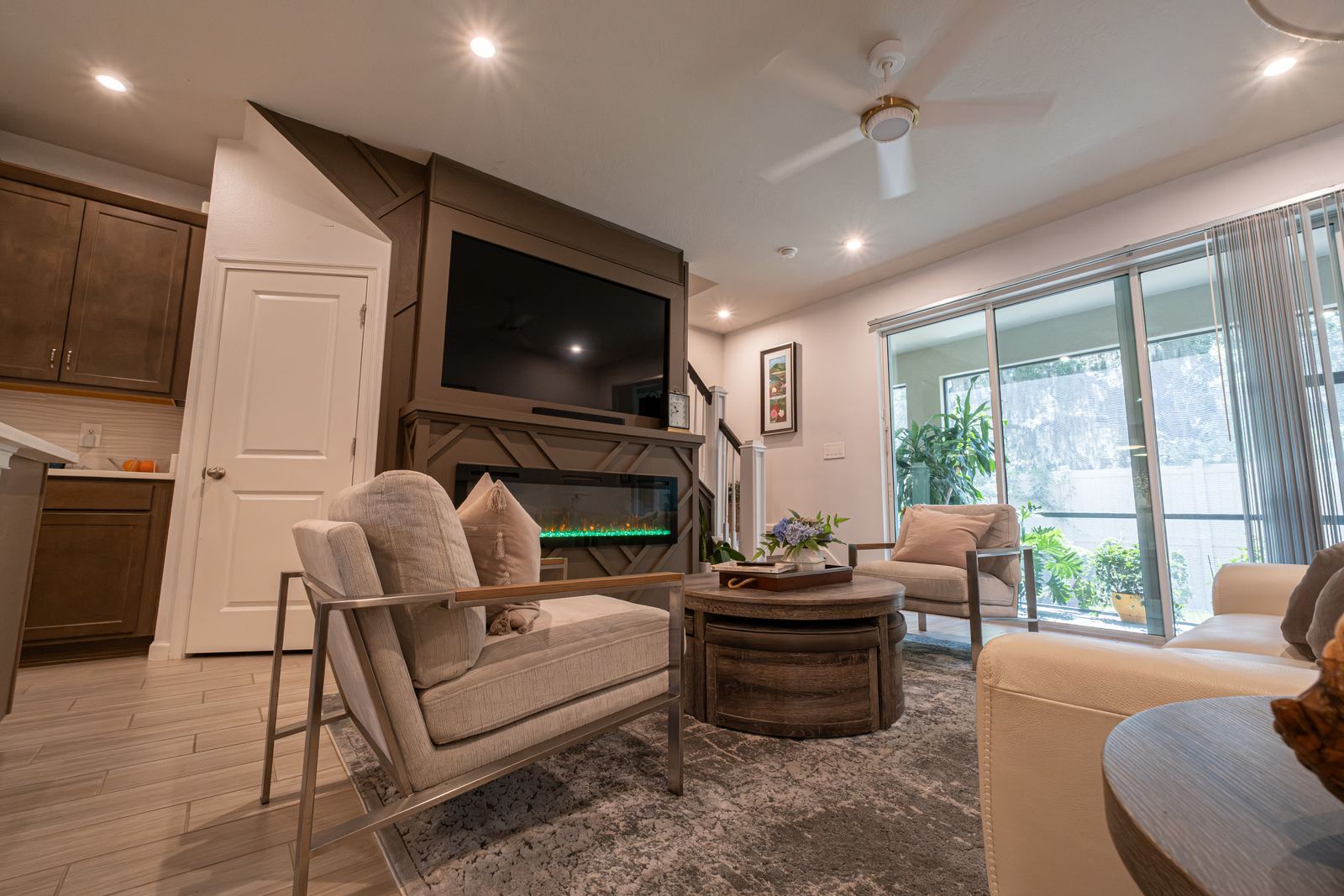 Bright living room with a fireplace and dining area